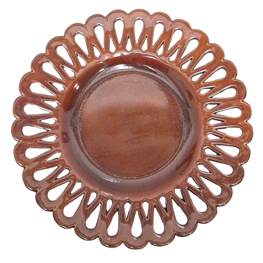 A round ceramic plate with a scalloped, openwork rim in a glossy brown glaze, shown from a top-down view on a white background.