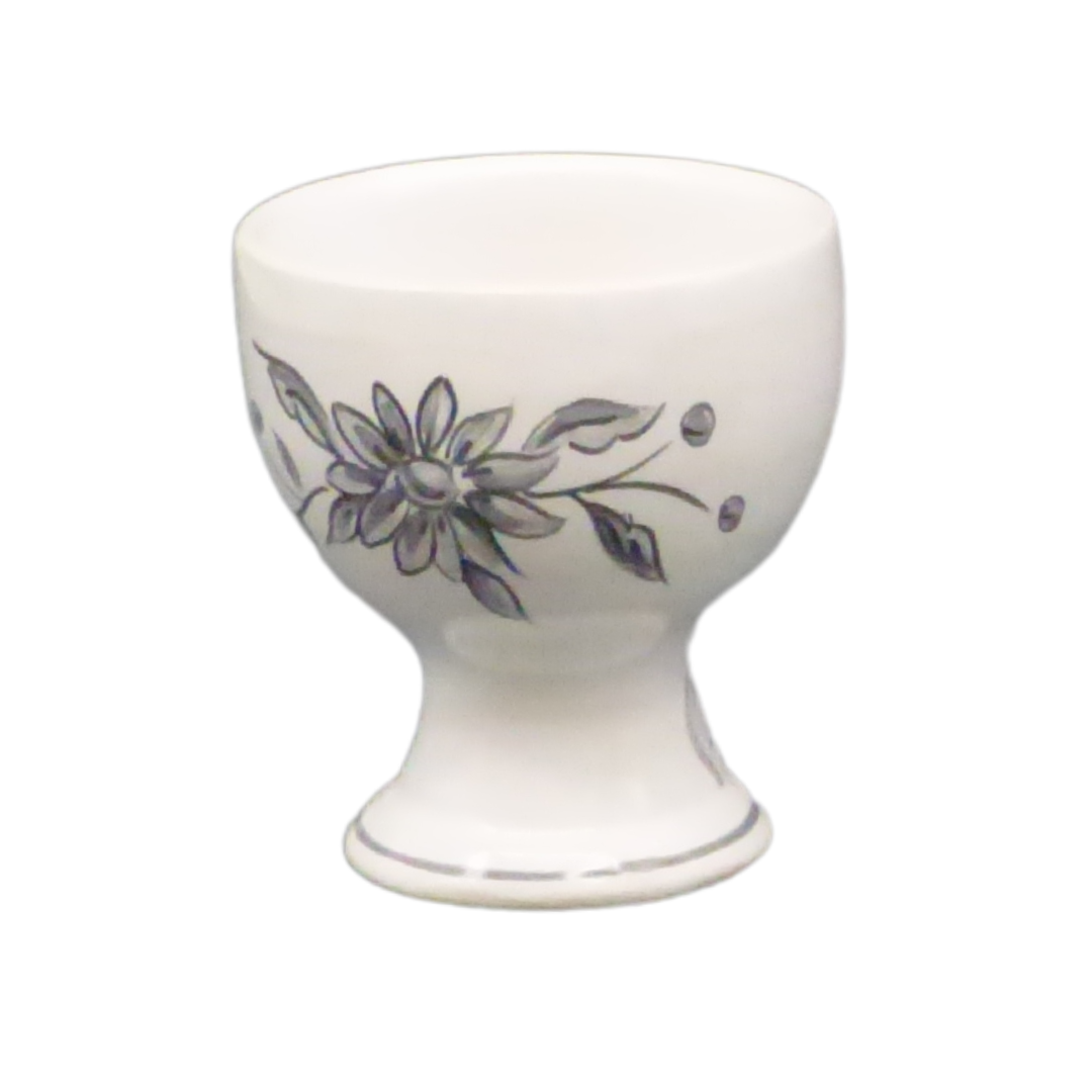 Simple egg cup with a grey hand painted flower