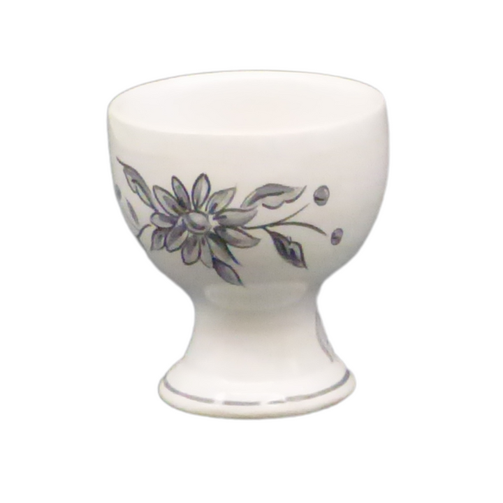 Simple egg cup with a grey hand painted flower