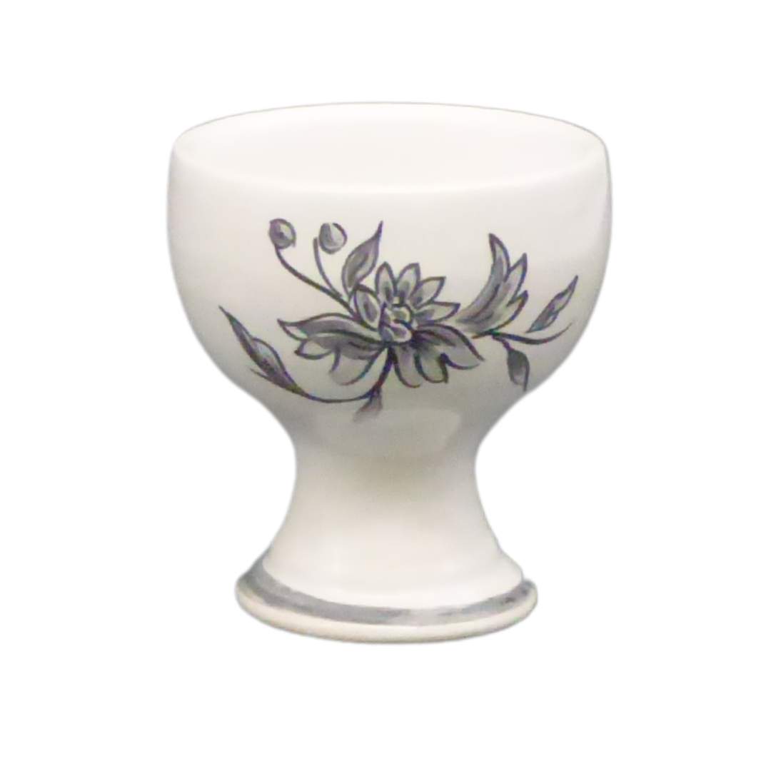 Simple egg cup with a grey hand painted flower
