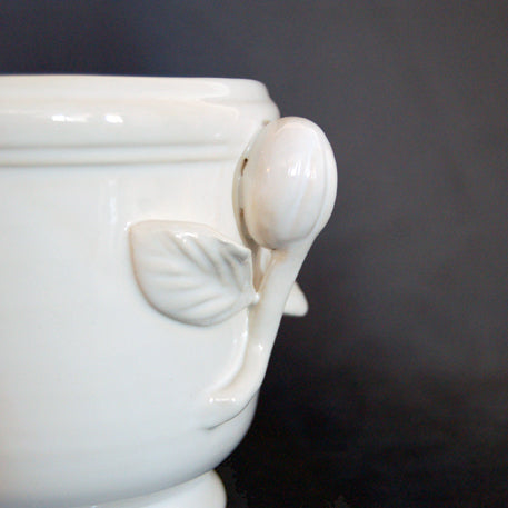 Ceramic planter fruit shaped handles close up