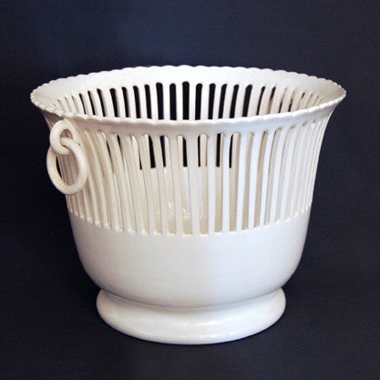 Openwork ceramic planter with handles side view
